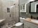 Bathroom featuring a tiled shower, toilet, vanity with granite countertop, and decorative mirror at 762 Swanson Ave Ave, Charleston, SC 29412