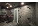 Contemporary bathroom featuring dual vanities, a glass shower, and stone tile walls at 762 Swanson Ave Ave, Charleston, SC 29412