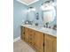 Bathroom features a double sink vanity with marble countertop and oval mirrors at 762 Swanson Ave Ave, Charleston, SC 29412