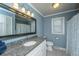 Bathroom with a granite countertop vanity, large mirror, and shower with curtain at 762 Swanson Ave Ave, Charleston, SC 29412