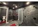 Bathroom featuring a walk-in shower with black fixtures and an adjacent double vanity at 762 Swanson Ave Ave, Charleston, SC 29412