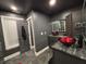 Modern bathroom featuring granite countertops, red glass vessel sinks, and dark cabinets at 762 Swanson Ave Ave, Charleston, SC 29412