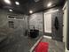 Modern bathroom featuring a stone accent wall and a freestanding tub at 762 Swanson Ave Ave, Charleston, SC 29412