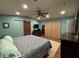 A spacious bedroom with a ceiling fan and aqua-painted walls at 762 Swanson Ave Ave, Charleston, SC 29412