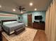 A bedroom featuring wood floors and a wooden sliding closet door at 762 Swanson Ave Ave, Charleston, SC 29412