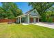 Charming detached garage with ample parking space and well-maintained landscaping at 762 Swanson Ave Ave, Charleston, SC 29412