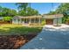 A lovely single-story home with a welcoming front porch, lush landscaping and a private driveway at 762 Swanson Ave Ave, Charleston, SC 29412