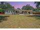 Charming single-story home with a spacious front yard and inviting front porch at 762 Swanson Ave Ave, Charleston, SC 29412