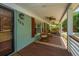 Cozy front porch with rocking chairs, ceiling fans, and a welcoming atmosphere at 762 Swanson Ave Ave, Charleston, SC 29412