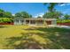Charming single-story home with a covered front porch, a basketball hoop and a spacious front yard at 762 Swanson Ave Ave, Charleston, SC 29412