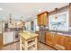 Bright kitchen featuring wood cabinets, stainless appliances, and a central island with a cooktop at 762 Swanson Ave Ave, Charleston, SC 29412