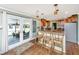 Bright kitchen featuring breakfast bar, custom cabinetry, and easy access to the outdoor patio at 762 Swanson Ave Ave, Charleston, SC 29412