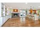 Open living space featuring built-in shelving, a brick fireplace, and access to a well-equipped kitchen at 762 Swanson Ave Ave, Charleston, SC 29412