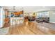 Spacious living area showcasing hardwood floors, a fireplace, and seamless flow to the dining and kitchen at 762 Swanson Ave Ave, Charleston, SC 29412