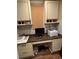 Home office with built-in desk, cabinets, printer, and monitor at 762 Swanson Ave Ave, Charleston, SC 29412