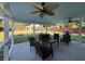 Covered patio with comfortable seating, ceiling fans, and view of the backyard at 762 Swanson Ave Ave, Charleston, SC 29412