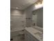 Clean white bathroom featuring tub/shower combo, toilet, and modern vanity at 7763 Park Gate Dr, North Charleston, SC 29418