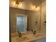 Bathroom vanity with double sinks, bronze faucets, a large mirror, and modern lighting at 7763 Park Gate Dr, North Charleston, SC 29418