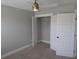 Bedroom with ceiling fan and closet with white shelving for optimal storage and organization at 7763 Park Gate Dr, North Charleston, SC 29418