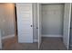 Bedroom featuring closet with doors ajar and adjacent white door at 7763 Park Gate Dr, North Charleston, SC 29418