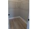 View into closet with a wooden floor and overhead rail at 7763 Park Gate Dr, North Charleston, SC 29418