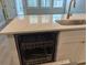 Gleaming white kitchen island with stainless steel dishwasher beneath granite countertop at 7763 Park Gate Dr, North Charleston, SC 29418