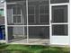 View of screened porch with neutral siding and white trim and door at 7763 Park Gate Dr, North Charleston, SC 29418