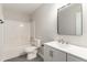 A view of a bathroom featuring a vanity, mirror, toilet, and shower/tub at 8044 Old London Rd, North Charleston, SC 29406
