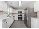 Modern kitchen featuring white cabinets, stainless steel appliances, and a subway tile backsplash at 8044 Old London Rd, North Charleston, SC 29406