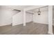 Bright living room with gray floors, white walls, open stairs and a decorative chandelier at 8044 Old London Rd, North Charleston, SC 29406