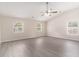 Spacious main bedroom with vaulted ceiling, fan, and plenty of natural light from three windows at 8044 Old London Rd, North Charleston, SC 29406