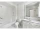 Clean, well-lit bathroom with white subway tile shower and marble countertop vanity at 8187 Jack Island Dr, Johns Island, SC 29455