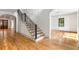 Inviting foyer with staircase, hardwood floors, and an archway to the right at 8187 Jack Island Dr, Johns Island, SC 29455