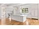 Bright kitchen features an island with a white countertop and stainless steel appliances at 8187 Jack Island Dr, Johns Island, SC 29455