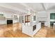 Open floorplan featuring kitchen with island, stainless appliances, and a living room with fireplace at 8187 Jack Island Dr, Johns Island, SC 29455