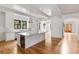 Bright kitchen with white cabinets, marble countertops, wine fridge, and stainless steel appliances at 8187 Jack Island Dr, Johns Island, SC 29455