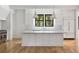 Bright kitchen features an island with a white countertop and stainless steel appliances at 8187 Jack Island Dr, Johns Island, SC 29455