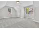 Bright bedroom featuring neutral carpet, a vaulted ceiling, and natural light from multiple windows at 8618 Woodland Walk, North Charleston, SC 29420