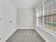 Bright, spacious bedroom with carpet floors, double door closet, and a large window at 8618 Woodland Walk, North Charleston, SC 29420