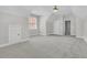 Large bedroom with neutral carpet, a ceiling fan, and a closet, offering ample storage at 8618 Woodland Walk, North Charleston, SC 29420