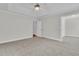 Spacious bedroom with carpet and an entry into a bathroom at 8618 Woodland Walk, North Charleston, SC 29420