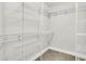 Bright walk in closet with wire shelving and carpeted flooring at 8618 Woodland Walk, North Charleston, SC 29420