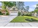 Beautiful home with a two-car garage, inviting front porch, and manicured landscaping at 8618 Woodland Walk, North Charleston, SC 29420