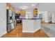 An open kitchen featuring wood cabinets and stainless appliances at 8618 Woodland Walk, North Charleston, SC 29420