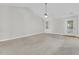 Spacious living room with vaulted ceilings, a ceiling fan, and a door to the outside at 8618 Woodland Walk, North Charleston, SC 29420