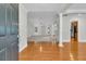 Bright and open living area with hardwood floors and elegant architectural details at 8618 Woodland Walk, North Charleston, SC 29420