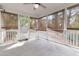 Enclosed screened porch with a ceiling fan, offering a shaded retreat at 8618 Woodland Walk, North Charleston, SC 29420