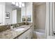 Well-lit bathroom featuring a granite countertop vanity and a shower-tub combo with tile surround at 914 Red Coat Run, Mount Pleasant, SC 29464