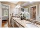 Bathroom featuring a double vanity with granite countertop and a view into the bedroom at 914 Red Coat Run, Mount Pleasant, SC 29464