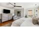 Bedroom with hardwood floors, a ceiling fan, and natural light coming in from the balcony at 914 Red Coat Run, Mount Pleasant, SC 29464